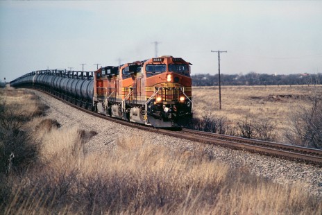 A Houston-bound BNSF Railway tank train hauling sulfur passes Childress, Texas, in June of 2006. In earlier years, this commodity was shipped by ATSF in closed hopper cars. Photograph by J. Parker Lamb. Lamb-03-036-09.JPG; © 2016, Center for Railroad Photography and Art