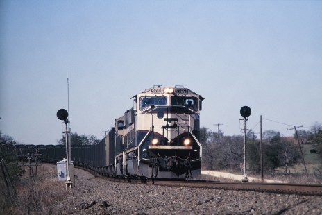 Southbound Burlington Northern and Santa Fe Railway coal train approaches Rogers siding (south of Taylor, Texas) in November of 2002. Photograph by J. Parker Lamb. Lamb-03-035-12;  © 2016, Center for Railroad Photography and Art