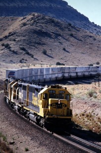 Westbound Atchison, Topeka and Santa Fe Railway stack train emerges from Abo Canyon en route from Mountainair to Belen, New Mexico, in July of 1991. Photograph by J. Parker Lamb. Lamb-03-034-07.JPG; © 2016, Center for Railroad Photography and Art