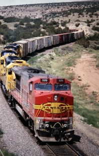Eastbound Atchison, Topeka and Santa Fe Railway intermodal train exits Abo Canyon, in July of 1994. Photograph by J. Parker Lamb. Lamb-03-034-01.JPG; © 2016, Center for Railroad Photography and Art