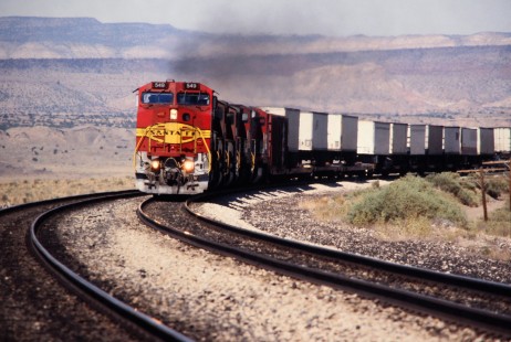 Eastbound Atchison, Topeka and Santa Fe Railway Trailers on Flat Cars (TOFC) train approaches Dalies, New Mexico junction in July of 1991. Photograph by J. Parker Lamb. Lamb-03-033-08.JPG; © 2016, Center for Railroad Photography and Art