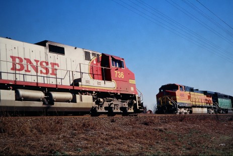 Houston-bound Burlington Northern and Santa Fe Railway train (left) passes Rogers siding (south of Temple, Texas) in December of 2001. Photograph by J. Parker Lamb. Lamb-03-036-12.JPG; © 2016, Center for Railroad Photography and Art