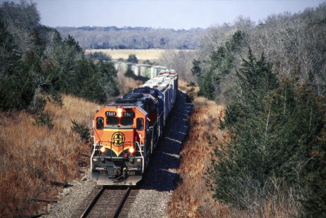 Southbound Burlington Northern and Santa Fe Railway grain train approaches Brenham, Texas, in February of 2002. Photograph by J. Parker Lamb. Lamb-03-036-05.JPG; © 2016, Center for Railroad Photography and Art