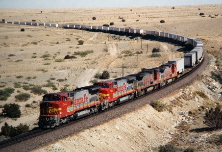 Eastbound Atchison, Topeka and Santa Fe Railway Trailers on Flat Cars (TOFC) entering Abo Canyon east of Belen, New Mexico, in June of 1991. Photograph by J. Parker Lamb. Lamb-03-034-03.JPG; © 2016, Center for Railroad Photography and Art