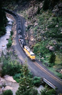 Union Pacific Railroad locomotive no. 8076 leads eastbound coal train through deep canyon en route to Tennessee Pass near Kerby Oregon, in August of 1997. Photograph by J. Parker Lamb. Lamb-03-040-05.JPG; © 2016, Center for Railroad Photography and Art