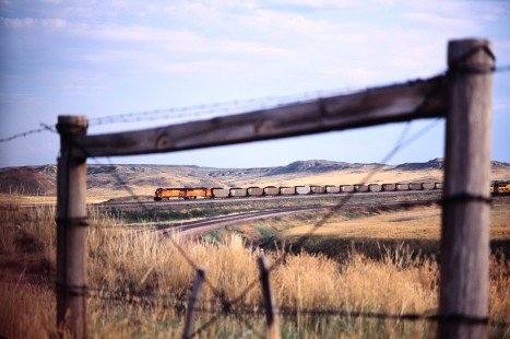 Northbond BNSF Railway coal loads pass Caballo Mine loadout on Powder River Basin fields in Gillette, Wyoming, in August of 2005. Photograph by J. Parker Lamb. Lamb-03-043-11.JPG; © 2016, Center for Railroad Photography and Art