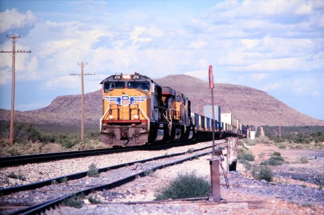 Union Pacific Railroad locomotive no. 4591 with westbound intermodal departs Valentine, Texas, en route to El Paso, in April of 2003. Photograph by J. Parker Lamb. Lamb-03-041-04.JPG; © 2016, Center for Railroad Photography and Art