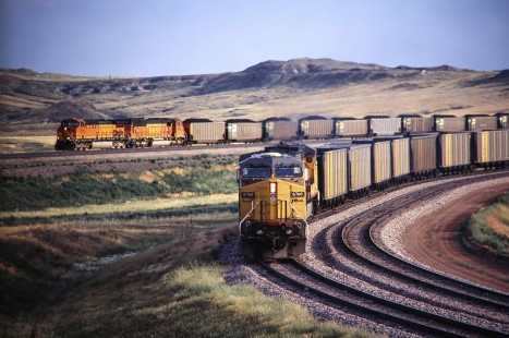 A BNSF Railway northbound passes Union Pacific Railroad locomotive no. 6760 entering Caballo loadout spur in Gillette, Wyoming, in August of 2005. Photograph by J. Parker Lamb. Lamb-03-043-12.JPG; © 2016, Center for Railroad Photography and Art