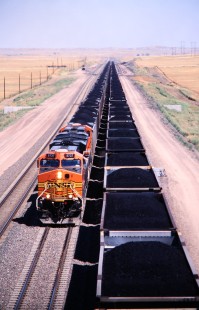 Two southbound BNSF Railway coal trains climb upgrade toward the terminal at Bill, an unincorporated community in Converse county, Wyoming, in August of 2005. Photograph by J. Parker Lamb. Lamb-03-043-07.JPG; © 2016, Center for Railroad Photography and Art