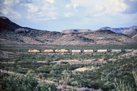 Union Pacific Railroad locomotives no. 4591, no. 5529, and no. 4268 with westbound stack train depart Valentine, Texas, en route to El Paso, in April of 2003. Photograph by J. Parker Lamb. Lamb-03-042-04.JPG; © 2016, Center for Railroad Photography and Art