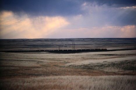 Northbound Union Pacific Railroad coal empties climb grade at dusk near Rio Junction located in Gillette, Wyoming, in August of 2005. Photograph by J. Parker Lamb. Lamb-03-041-19.JPG; © 2016, Center for Railroad Photography and Art