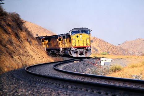 Union Pacific Railroad no. 8519 leads northbound train around S-curve as it approaches Caliente an unincorporated community in Kern county California, in October of 2001. Photograph by J. Parker Lamb. Lamb-03-040-07.JPG; © 2016, Center for Railroad Photography and Art