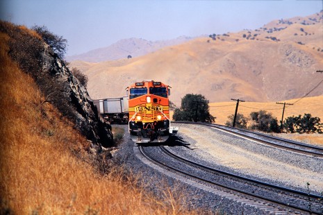 Burlington Northern and Santa Fe Railway locomotive no. 4619 with eastbound freight train approaches Bealville, California, in October of 2001. Photograph by J. Parker Lamb. Lamb-03-046-01.JPG; © 2016, Center for Railroad Photography and Art