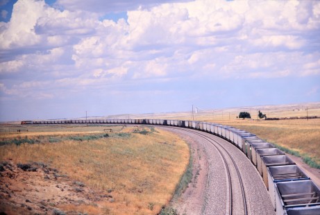 Northbound BNSF Railway hopper train curves across Wyoming's open spaces south of Gillette in August of 2005. Photograph by J. Parker Lamb. Lamb-03-043-16.JPG; © 2016, Center for Railroad Photography and Art