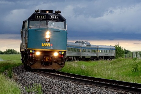 VIA Rail Canada train 692 rounds a curve near Roblin, Manitoba, on June 20, 2020. A pair of General Motors F40PH-2D's haul a five car consist including a Skyline series dome car back to Winnipeg.

David Maiers, in the small Canadian town of Roblin, writes that “here in Manitoba, the Covid-19 pandemic began to strike home in mid-March with the closing of various public places and precautions at grocery stores.” Fortunately, Maiers lives along the route of VIA’s route to remote Churchill, on Hudson Bay. “I try to not miss VIA when it comes through with its unique 1950's era stainless steel consist. While there are few surprises with this train it is nice to stay in touch with the hobby and the railroad by photographing it. Sometimes many hours late, it is worth the brief time together as it passes through.”

To see additional member work made during the Covid-19 pandemic, see “Creativity & Covid” in the <a href="http://www.railphoto-art.org/railroad-heritage-62/" rel="noreferrer nofollow">Fall 2020 issue of <i>Railroad Heritage</i></a>.