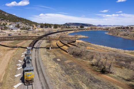 UP 8495 with unit empty gondola train GYPU-03 at Palmer Lake, Colorado, on the way from Granite, Wyoming to Pueblo, Colorado, on April 5, 2020.

Chip Sherman, who works for the Union Pacific in the Denver area, writes that the pandemic had a dramatic effect on his employer’s traffic levels, as well as on him personally: “I pulled the pin after some twenty-two-years with my last railroad job as of June 1, 2020! The coronavirus was a factor in that decision as age and my possible vulnerability on the job prompted my path towards retirement.” The slowdown did leave Chip some time to do some photography and explore the local area, but the decline of coal traffic, combined with the impacts of the pandemic, meant job cuts after job cuts. “Essential workers found their jobs disappeared at an astonishing rate,” Chip adds, before noting that he will miss his co-workers. Video conferencing, however, has helped somewhat. “The coronavirus cancelled all of my social gatherings. Fortunately, one group that normally met in Pueblo or Palmer Lake each month went to using Zoom conferencing. Great way to visit with other photographers from across the country! Programs were shared via Zoom with typically good results.”

To see additional member work made during the Covid-19 pandemic, see “Creativity & Covid” in the <a href="http://www.railphoto-art.org/railroad-heritage-62/" rel="noreferrer nofollow">Fall 2020 issue of <i>Railroad Heritage</i></a>.