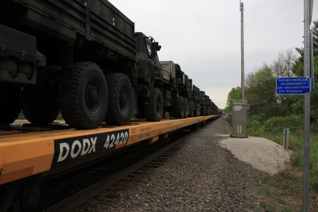 A long string of Military Vehicles viewed at a crossing at Duplainville, Wisconsin, being shipped from the factory on May 28, 2020.

Ed Knueppel, from Sussex, Wisconsin, found an unusual approach to making time during the pandemic: Moving to work after dark. “As the Covid-19 Pandemic unfolded in March 2020, the state of Wisconsin issued a “Safer at Home” order. This caused my employer to rapidly switch to having almost all employees telework all or part-time. I volunteered to switch to a third shift work ‘day’ to improve coverage as an essential worker. This resulted in much of my railfanning time being during the dark night hours and early morning as I returned home. As summer rolls by, I find myself back working full time during normal hours. I’ve noticed that despite the Covid-19 pandemic, I have continued to find ways to railfan and have not lost any enthusiasm towards the hobby. The state is opening back up but I continue to railfan alone and certainly miss the camaraderie of the Duplainville area railfans.”

To see additional member work made during the Covid-19 pandemic, see “Creativity & Covid” in the <a href="http://www.railphoto-art.org/railroad-heritage-62/" rel="noreferrer nofollow">Fall 2020 issue of <i>Railroad Heritage</i></a>.