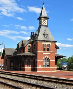 “Point of Rocks, Maryland,” writes John Cowgill of Fairfax, Virginia, “has an old-style train depot that is now an office for CSX and serves as a stop for commuter trains to Union Station in Washington D.C.  It is a common place for train watchers as it sits at a junction of the original B&O line with a line that was built through Washington D.C.”

Cowgill spent part of his lockdown in a mobile, auto-based quarantine. “The railroad museums were closed. The excursion trains were not able to run. I was stuck in my little space. What did I do? I wrote railroad stories, and, with many railroad sites closed, I used the time to get ahead on writing my railroad articles awaiting their reopening so that I could publish them…. When I was not quarantined in my little space, I was quarantined in my car. It was hard not being able to get out to ride trains and visit the museums, but with the trains still rolling, I was able to see the great men getting the cargo and the people to where they needed to go.”

To see additional member work made during the Covid-19 pandemic, see “Creativity & Covid” in the <a href="http://www.railphoto-art.org/railroad-heritage-62/" rel="noreferrer nofollow">Fall 2020 issue of <i>Railroad Heritage</i></a>.