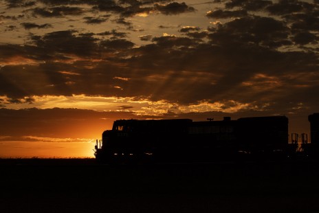 Norfolk Southern train 145 travels westbound in the countryside of Indiana at sunset, on June 1, 2020.

John Troxler of Logansport, Indiana writes that the pandemic and its associated economic slowdown had both positive and negative impacts on his photography. “The Covid-19 shutdown of manufacturing operations such as automotive assembly plants have directly impacted the class-1 railroad traffic where I live,” Troxler notes, adding that “train count reduced greatly, train symbols were cut, the two remaining Roadrailers running in the United States were stopped temporarily, and trainmen were furloughed.” The reduced traffic meant fewer easy subjects to photograph, and Troxler found himself waiting a lot. Yet the tedium also taught him to consider subjects he would have otherwise passed over. “The pandemic has driven me to sharpen my skill for hunting down great railroad images when the opportunities are lean and being prepared when the opportunities are presented. As the great Roman philosopher Seneca once stated, "luck is when opportunity meets preparation.”

To see additional member work made during the Covid-19 pandemic, see “Creativity & Covid” in the <a href="http://www.railphoto-art.org/railroad-heritage-62/" rel="noreferrer nofollow">Fall 2020 issue of <i>Railroad Heritage</i></a>.