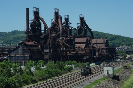 Norfolk Southern 3489 and 3421 at Bethlehem, Pennsylvania, on May 30, 2020.

Cliff Redanz of Perkasie, Pennsylvania writes of exploring his local railroad scene, including Bethlehem, Pennsylvania, site of the former Bethlehem Steel Works along the Lehigh River. Looking for a good vantage point on the old works, Redanz explored the Minsi Trail Bridge, spanning both the river and the railroad. “Though somewhat familiar with the area… I unexpectedly found [the bridge] lined with a very high, small-mesh, chain-link fence, making photography literally impossible!” However, he encountered a passerby who became Redanz’s “guardian angel.” “I learned that farther along on the bridge, someone in the past had cut a hole in the chain-link fencing, to facilitate photo-taking. This had obviously been a very dedicated railfan. Thank you, whoever you were, for making possible my Covid-19 rail breakout.”

To see additional member work made during the Covid-19 pandemic, see “Creativity & Covid” in the <a href="http://www.railphoto-art.org/railroad-heritage-62/" rel="noreferrer nofollow">Fall 2020 issue of <i>Railroad Heritage</i></a>.