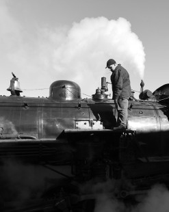 Fireman Alex Merrill blowing down the boiler of ex-Great Western 2-10-0 #90 at the Strasburg Rail Road in East Strasburg, Pennsylvania, on the morning of February 15th, 2020.