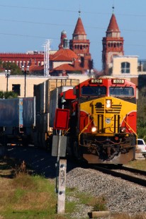 Florida East Coast Train 101-09 rolls south at St. Augustine, Florida, on February 9, 2020. In the background is what used to be the Towers and home of the Ponce de Leon Hotel originally built by Florida East Coast Railway's founder Henry Flagler.