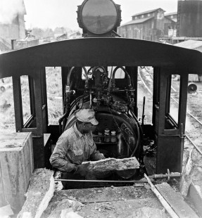 Shot in Hardeeville, South Carolina, in the early months of 1956, this image shows an Argent Lumber Company worker feeding the firebox of one of Argent's wood-burning locomotives. Throughout its history, Argent owned seven of these narrow-gauge steam locomotives. At the time of this photograph, Argent was the only interstate narrow gauge logging railroad in the nation. Photograph by Jim Shaughnessy. © 2021, Center for Railroad Photography and Art. Shaughnessy-N-ARGENT-0012.