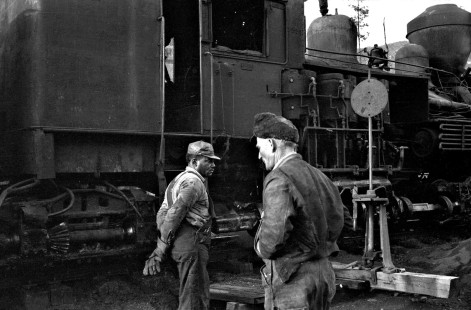 Black and white railroad workers stand next to a Shay steam locomotive of the Twin Seams Mining Company in Kellerman, Alabama, around 1960. Photograph by Ted Rose, © 2021, Center for Railroad Photography & Art, Rose-01-147-012