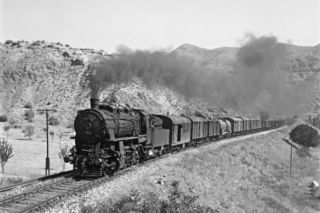 Turkish State Railways 45029, a 2-8-0 steam locmotive built by NOHAB in Sweden, leads a freight train south on the Samsun-Sivas Line near Amasya, Turkey, on September 10, 1973. Photograph by Victor Hand, collection of the Center for Railroad Photography & Art, Hand-TCDD-25-038