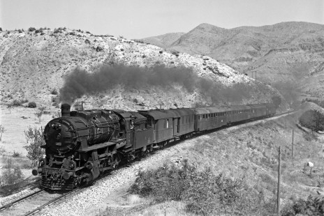 Turkish State Railways 2-8-0 locomotive 45021 leads the morning passenger train from Samsun to Sivas near Amasya, Turkey, on September 10, 1973. Photograph by Victor Hand, collection of the Center for Railroad Photography & Art, Hand-TCDD-25-047