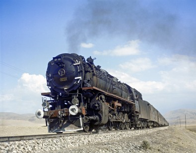 Turkish State Railways steam locomotive 56705, a French 2-10-0 built in 1943, leans into a curve with the Kurtalan-Ankara mail train near Kardeşgediği, Turkey, on September 13, 1973. Photograph by Victor Hand, collection of the Center for Railroad Photography & Art, Hand-TCDD-C25-03