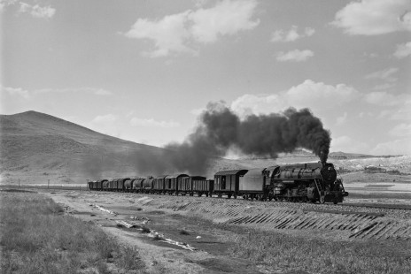 Turkish State Railways "Skyliner" 56373, a 2-10-0 steam locomotive built at the Vulcan Foundry in Wilkes-Barre, Pennsylvania, leads a freight train east on the Kayseri-Sivas Line near Bogazkopru, Turkey, on September 12, 1973. Photograph by Victor Hand, collection of the Center for Railroad Photography & Art; Hand-TCDD-25-094
