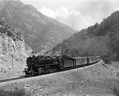 Turkish State Railways 56705, a 2-10-0 steam locomotive built in France, leads the Kurtalan to Ankara mail train west near Pozantı, Turkey, on September 13, 1973. Photograph by Victor Hand, Collection of the Center for Railroad Photography & Art, Hand-TCDD-25-105