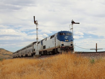 Amtrak passing the BNSF Semaphore at Wagon Mound, NM. June 21, 2020