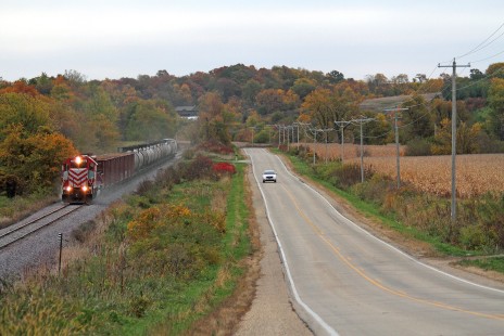 Wisconsin & Southern local L355 (Janesville - Monroe turn) ambles across the hilly terrain of southern Wisconsin near Juda, WI. October 11, 2020