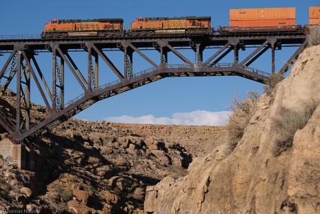 BNSF domestic intermodal train soars over the afternoon clouds at Canyon Diablo, AZ. November 1, 2020