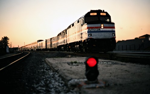 The <i>Texas Eagle</i> glows in the sunset at Joliet, Illinois, near the beginning of its run from Chicago to San Antonio on September 1, 1995. Photograph by John F. Bjorklund, collection of the Center for Railroad Photography & Art, Bjorklund-06-07-02