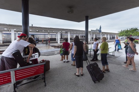 Passengers prepare for departure on Amtrak's westbound <i>California Zephyr</i> in Burlington, Iowa, on July 21, 2013. Photograph by Scott Lothes, president and executive director of the Center for Railroad Photography & Art