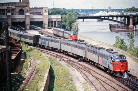 Three Amtrak E-units couple onto the <i>North Coast Hiawatha</i> at the Minneapolis Great Northern Depot on July 25, 1973. The station was demolished in 1978 and the train discontinued in 1979. Today Amtrak's <i>Empire Builder</i> serves the Twin Cities at St. Paul Union Depot. Photograph by John F. Bjorklund, Center for Railroad Photography & Art, Bjorklund-08-11-01