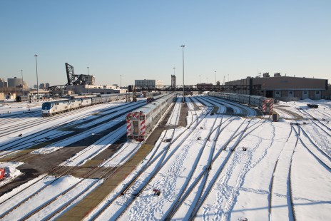 Amtrak train 6, the <i>California Zephyr</i>, arrives in Chicago, Illinios, on the afternoon of February 27, 2015, following its two-day run from Emeryville, California. Behind the usual pair of P42 locomotives is a new Seimens ACS-64 electric, built in Sacramento for service on the Northeast Corridor. At center and right, Metra commuter trains await their next runs. Photograph by Todd Halamka, a board member of the Center for Railroad Photography & Art