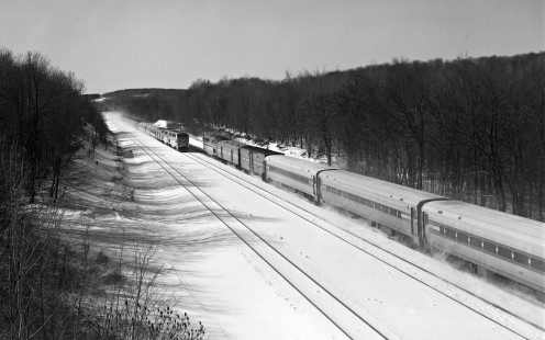 Amtrak's <i>Three Rivers</i> (left) and <i>Pennsylvanian</i> passenger trains kick up snow as they pass one another on the former Pennsylvania Railroad main line near Cresson, Pennsylvania, on January 19, 1999. Photograph by Victor Hand, collection of the Center for Railroad Photography & Art, Hand-AM-59-688
