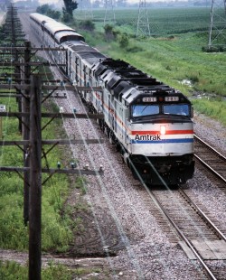 On July 14, 1990, Amtrak train 6, the <i> California Zephyr</i>, follows the pole line into Cameron, Illinois, where the former Burlington main line ducks under the Santa Fe. A station stop at Galesburg is just ahead. Photograph by John F. Bjorklund, collection of the Center for Railroad Photography & Art, Bjorklund-05-28-06