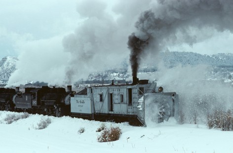 Denver and Rio Grande Western Railroad rotary snowplow OM and Cumbres and Toltec Scenic Railroad steam locomotive nos. 487 and 483 east of Chama, New Mexico, on February 15, 1976. Photograph by Katherine Botkin. BOTKINK-08-KT-300, © 1976, Katherine Botkin.