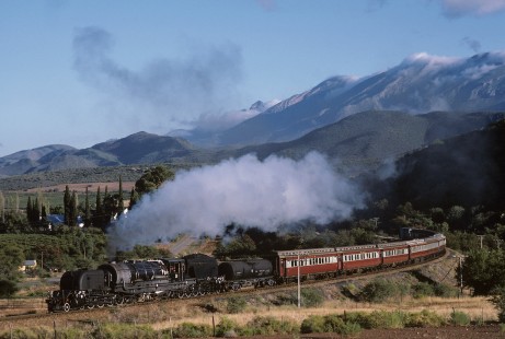 South African Railways GMAM-class steam locomotive no. 4072 leads passenger train at Stompdrift, a railroad siding in Cape Province (present-day Western Cape), South Africa, on April 21, 1987. Photograph by Katherine Botkin. BOTKINK-113-KT-247, © 1987, Katherine Botkin