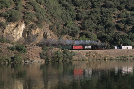 Comboios de Portugal (Trains of Portugal) steam locomotive no. 0186 with eastbound train near Pinhão, Douro, Portugal, on September 21, 2004. Photograph by Katherine Botkin. BOTKINK-111-KT-03, © 2004, Katherine Botkin