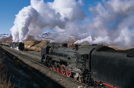 Eastbound Jitong Railway QJ-class steam locomotive no. 6303 and unidentified locomotive meet at Sandi, a station in Inner Mongolia, China, on November 22, 2003. Photograph by Katherine Botkin. BOTKINK-103-KT-156, © 2003, Katherine Botkin