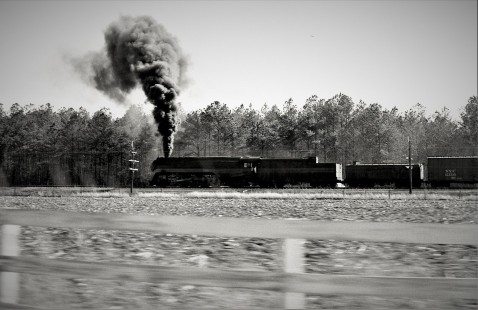 Norfolk & Western Railway J-class 4-8-4 steam locomotive 606 leads a freight train near Suffolk, Virginia, in April 1959.

Judges' comments: Streamlined Norfolk & Western steam locomotives of the K- and J-class provide a fascinating window to the past in this series of images, which thoroughly captured the imagination of the judges. The beautiful execution, description of context, and film-grain texture of these classic N&W engines—depicted at rest in the rain, at night ready to depart, and at speed in pacing action—comprise a memorable set of images. 

Read more about the 2021 John E. Gruber Creative Awards Program: <a href="https://railphoto-art.org/awards/2021-awards/" rel="noreferrer nofollow">railphoto-art.org/awards/2021-awards/</a>