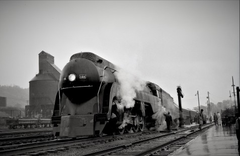 Norfolk & Western K2 4-8-2 steam locomotive 124 leads a passenger train at Bluefield, West Virginia, in March 1958.

Judges' comments: Streamlined Norfolk & Western steam locomotives of the K- and J-class provide a fascinating window to the past in this series of images, which thoroughly captured the imagination of the judges. The beautiful execution, description of context, and film-grain texture of these classic N&W engines—depicted at rest in the rain, at night ready to depart, and at speed in pacing action—comprise a memorable set of images. 

Read more about the 2021 John E. Gruber Creative Awards Program: <a href="https://railphoto-art.org/awards/2021-awards/" rel="noreferrer nofollow">railphoto-art.org/awards/2021-awards/</a>