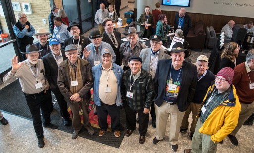 Attendees wore so many interesting hats that a group photo had to be made! Photo by Ken Rehor with Elrond Lawrence's camera.