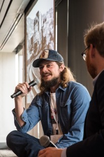 Country & western singer Erik Shicotte is interviewed by the Center's Justin Franz about his music and rail photography. Elrond Lawrence photo.